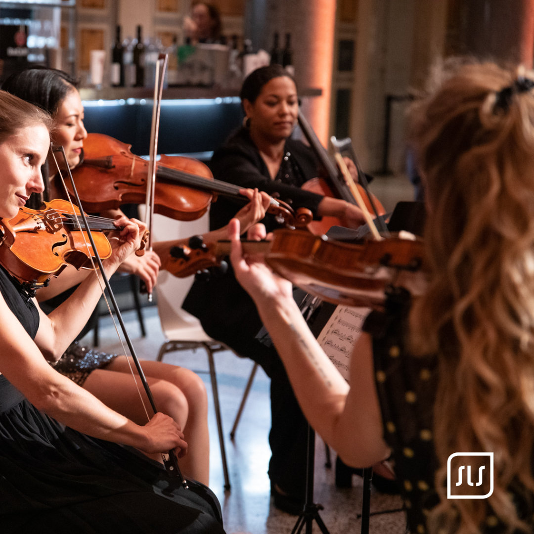 Vier Musikerinnen spielen Streichinstrumente bei einer Veranstaltung der PAPCON 2023